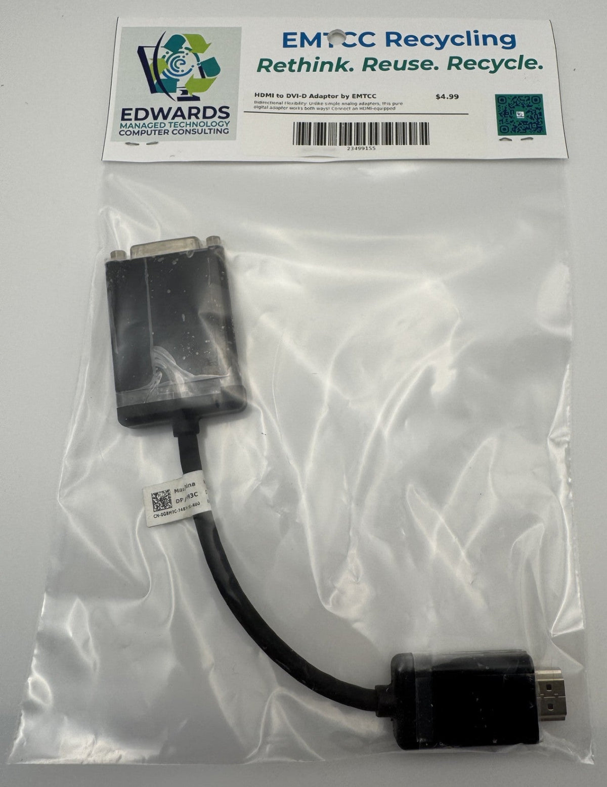 Computer adapter in a clear plastic bag with Edwards Computer Consulting branding.