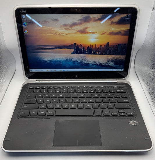 Laptop with keyboard attached on a white surface