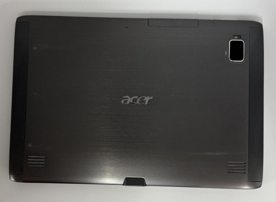 Black Acer tablet on a white surface